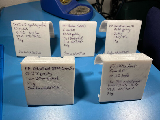 Five 3D printed test objects, base up, showing the individual profiles and temperatures used, as well as other details.