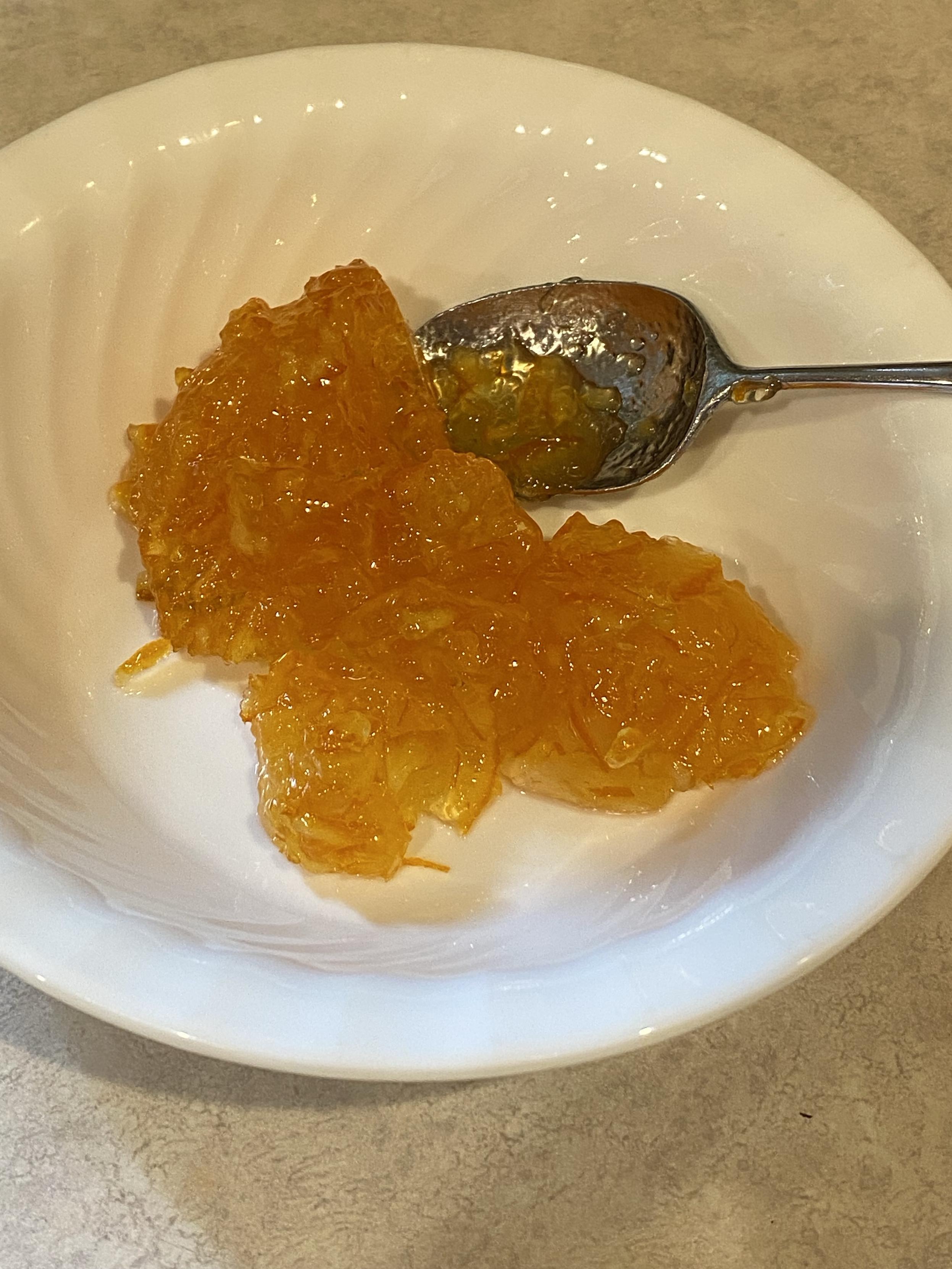 a bowl and a spoon and 160g of marmalade