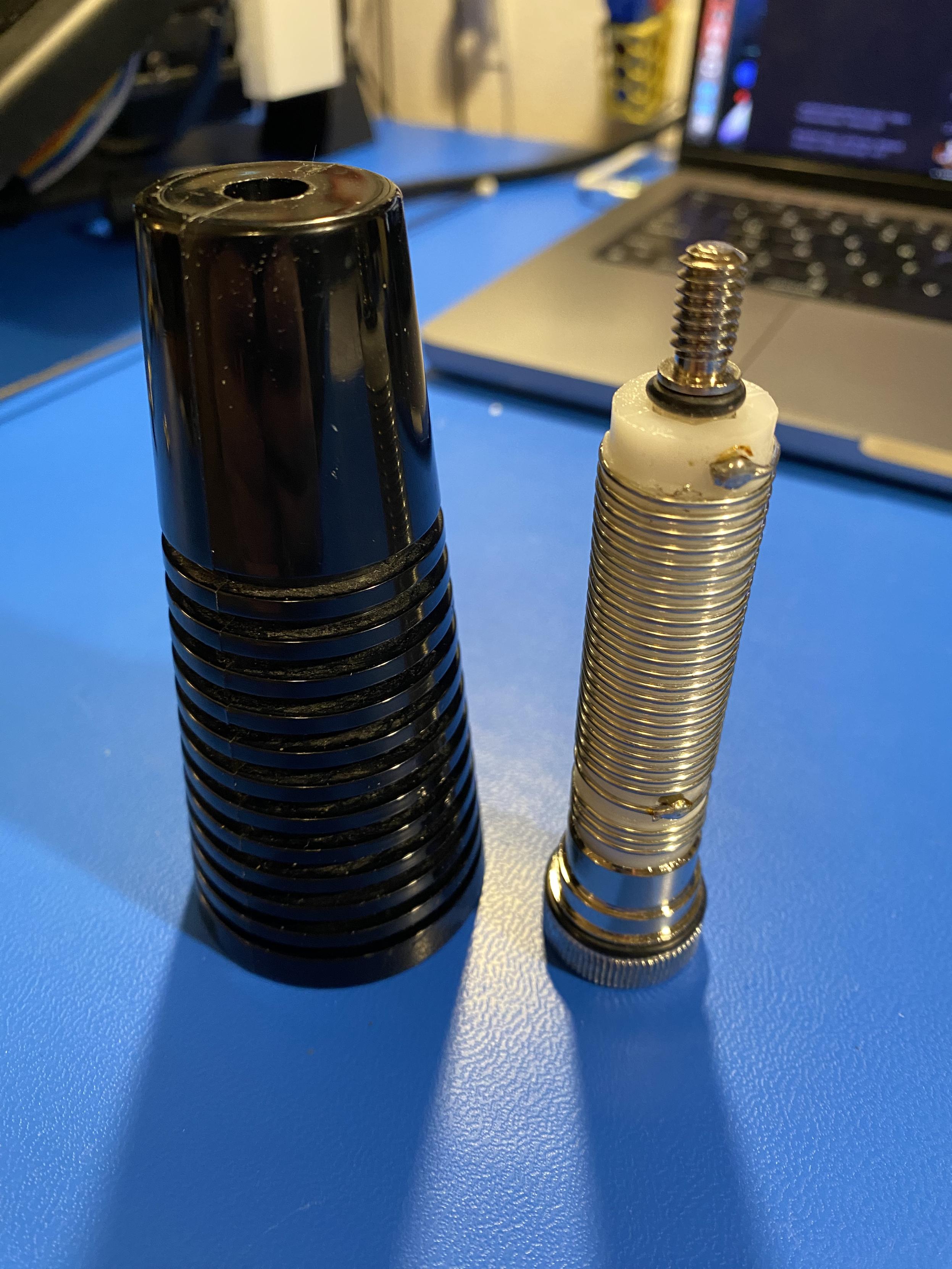 a plastic radio base cone with the extracted contents which includes a _massive_ coil joining the shield and centre wires, clearly some kind of CB-related filter