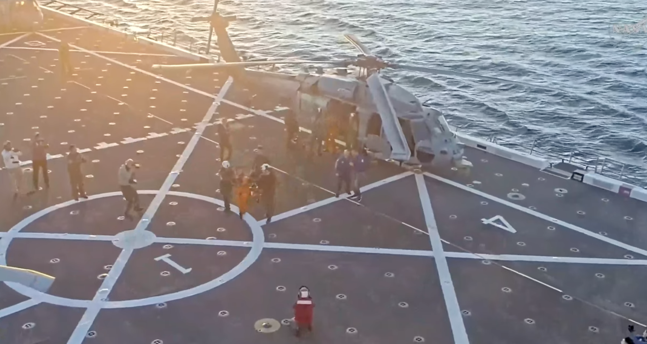 Artemis 2 flight crew walking across the flight deck under her own power. It's a short walk to the med bay.