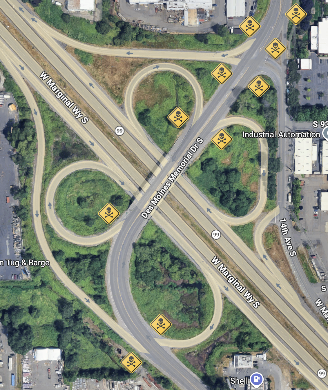 Des Moines Memorial Drive S. over W. Marginal Way/Highway 99, a full cloverleaf intersection with epaulettes giving five merge car and truck merger points EACH DIRECTION that you have to avoid at HIGHWAY SPEED, any one of which would kill you. They're marked by skull and crossbones against a yellow warning diamond.