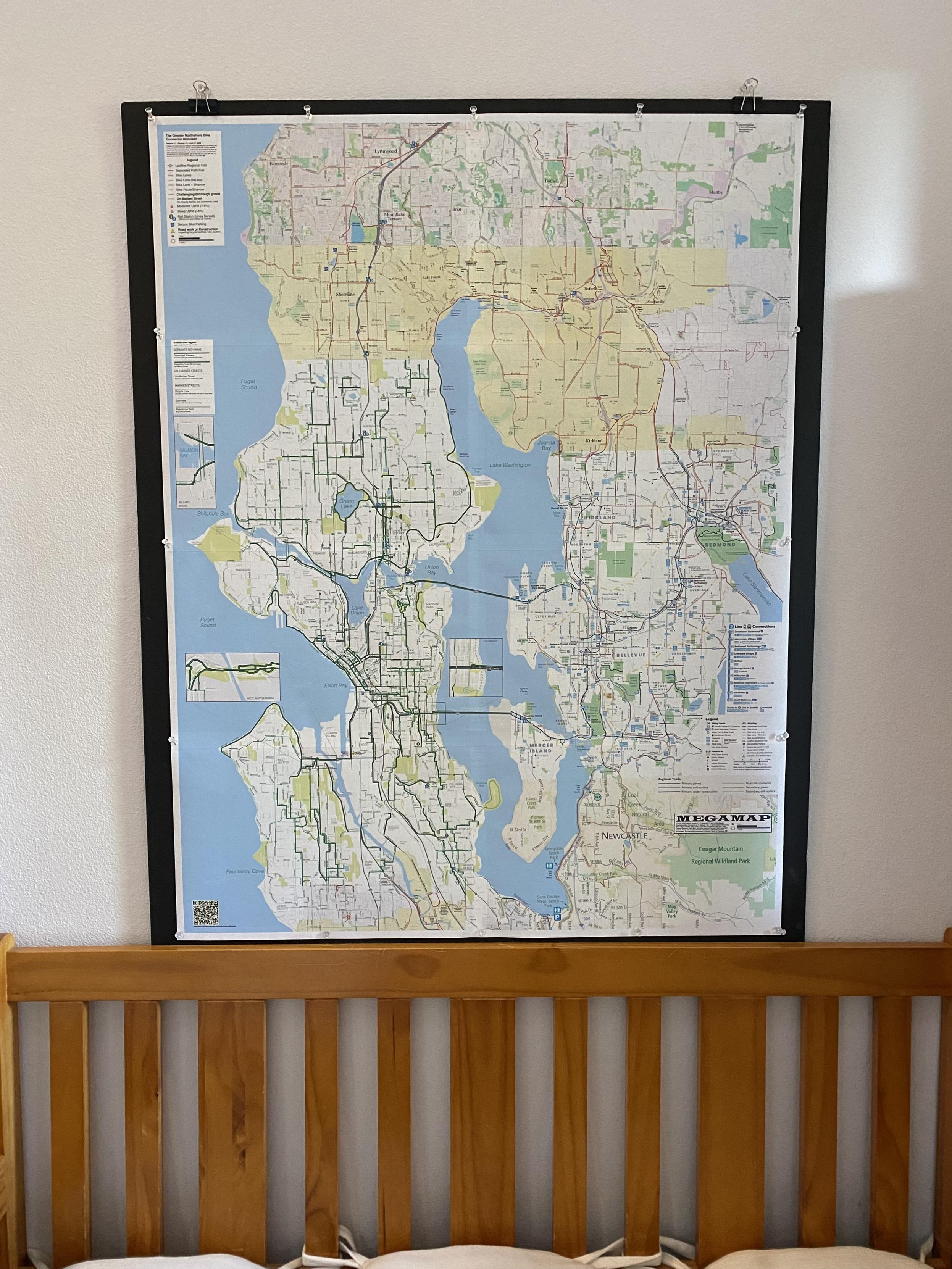 The MEGAMAP pinned to black foamcore hanging above and behind the bench in our entryway.
