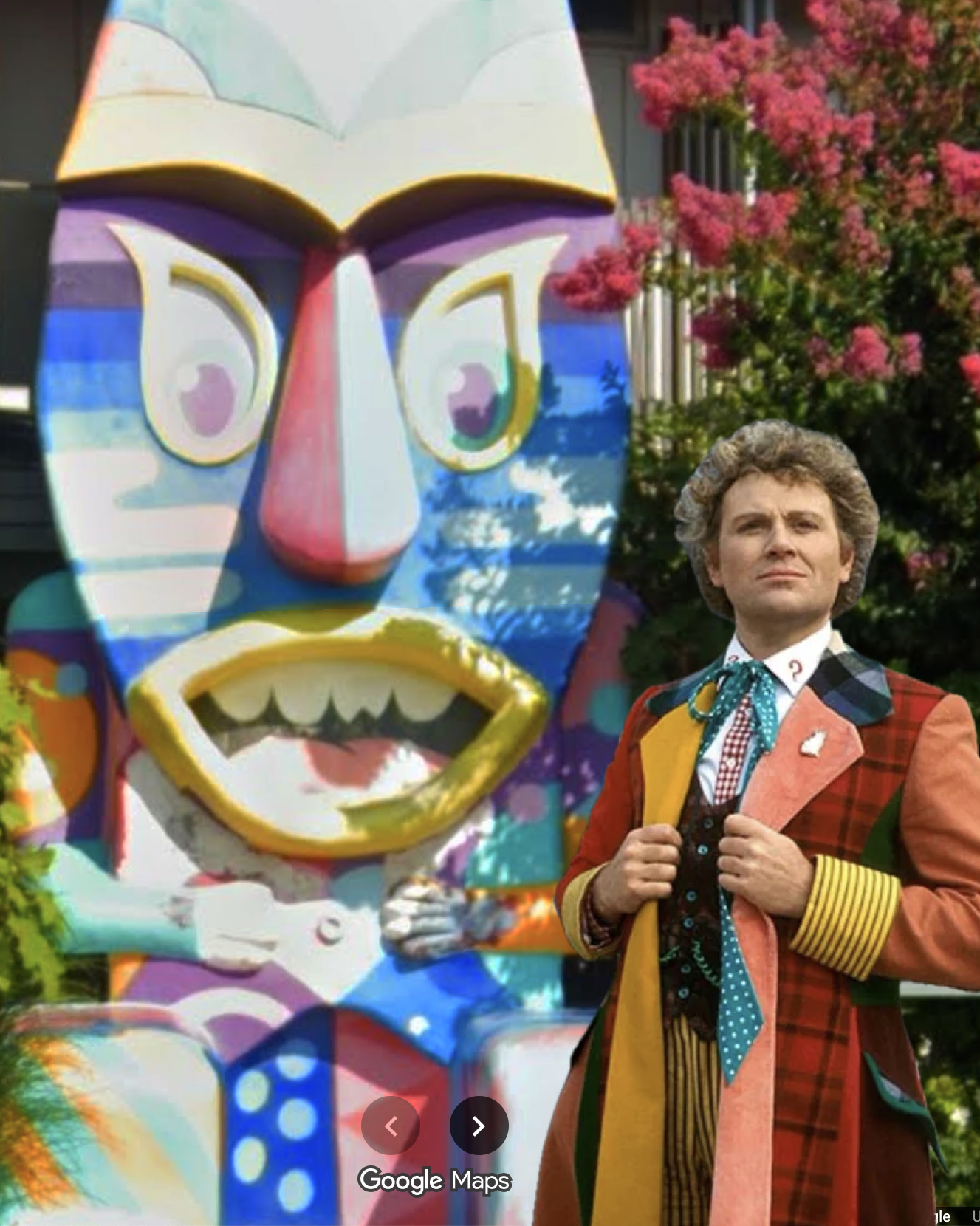 the tiki painted in what immediately makes me think of a clown suit next to the very similarly bedecked colin baker sixth doctor and honestly they really do look like they're wearing about the same uniform. also they're in exactly the same pose somehow, hands front and centre holding the edges of their jackets