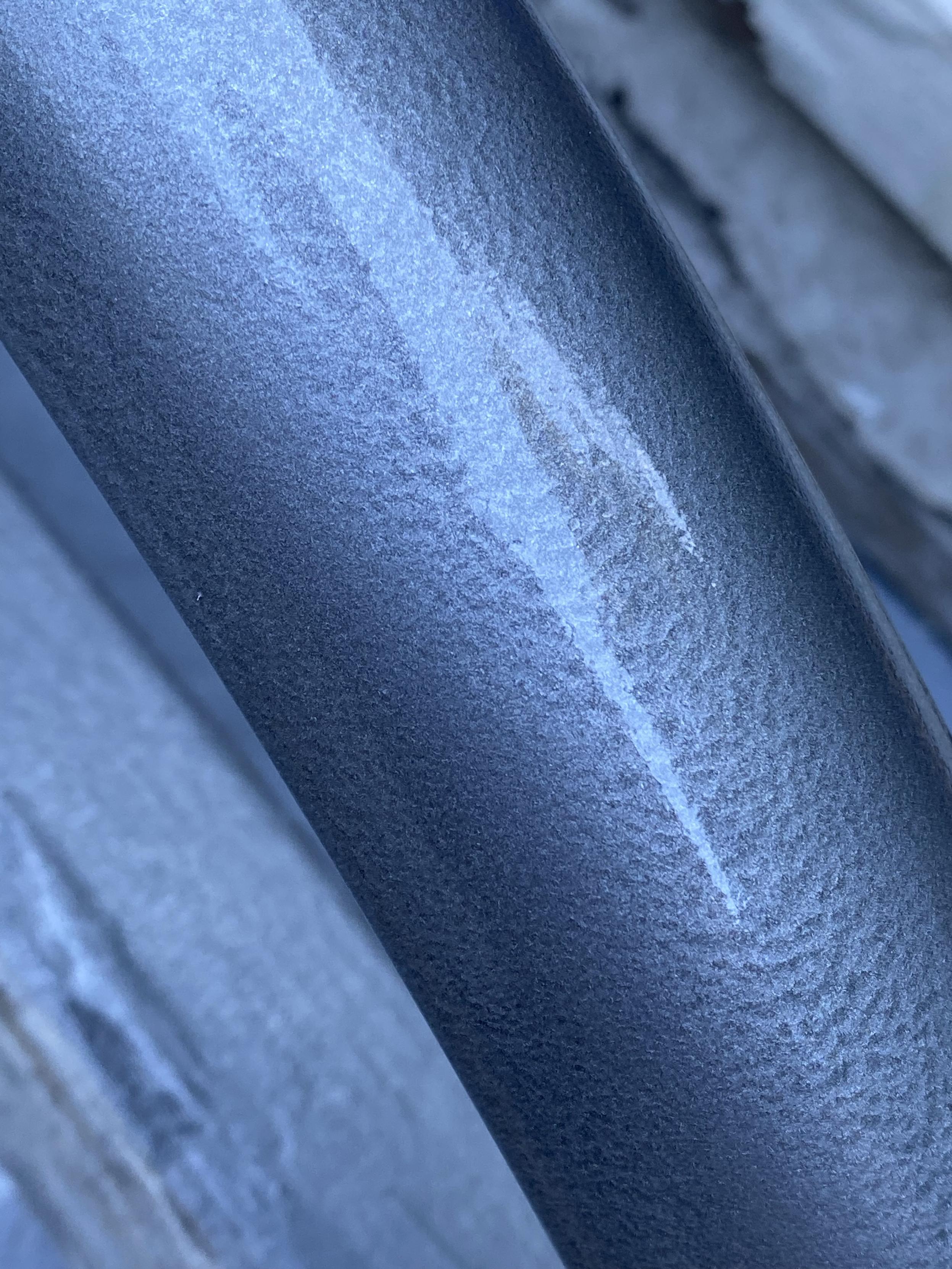 close-up of the hammered texture on the painted fender, showing how it’s even despite the surface underneath having so many rust pockets